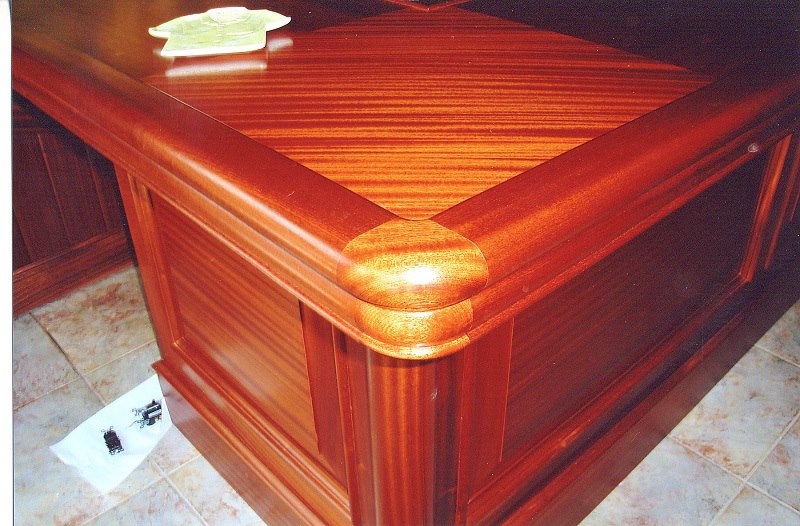 Burl and mahogany bar top with hand-fitted banding