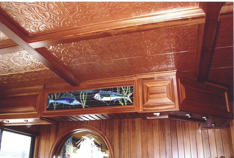 Mahogany coffered ceiling with custom stained-glass panel