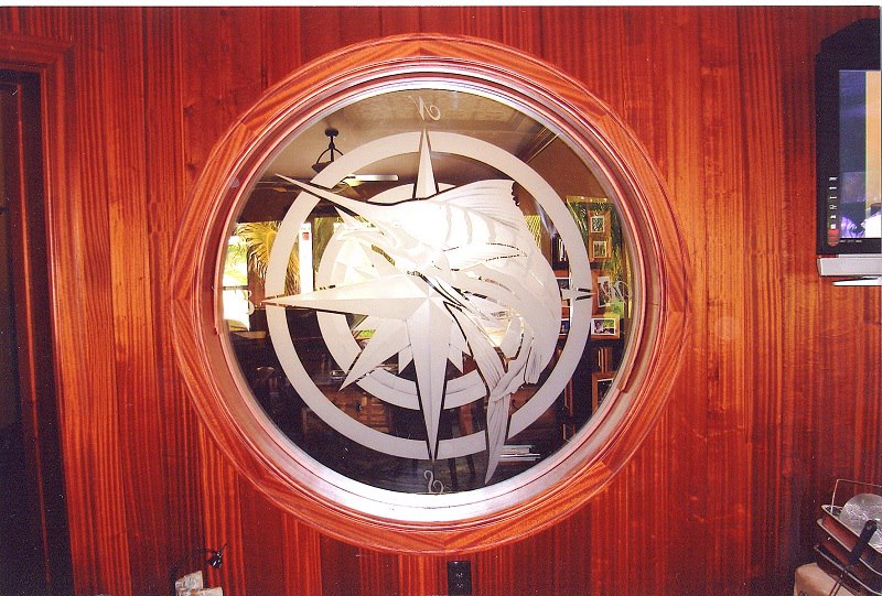 Round compass window set into cedar paneling