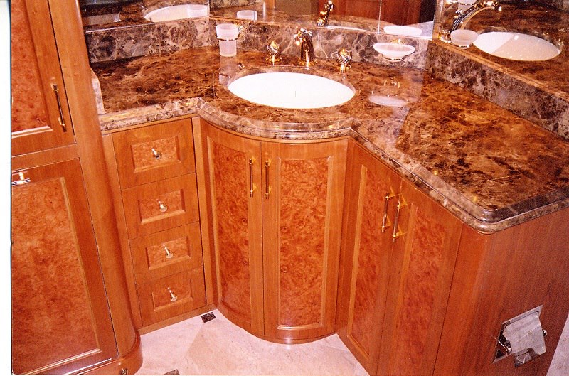 Double vanity with figured veneers and brown marble
