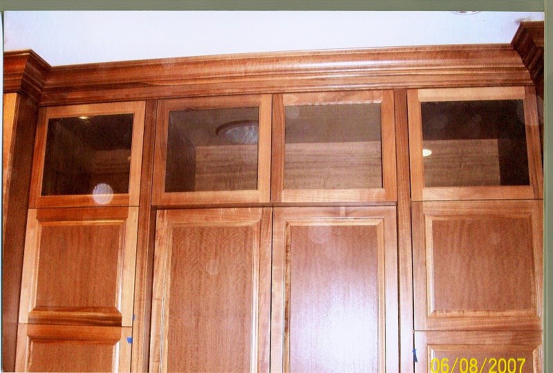 Mahogany wardrobe with glass-front uppers and crown