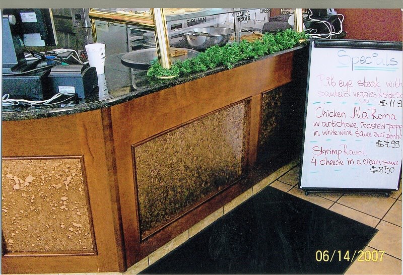 Restaurant service counter with a copper-panel front