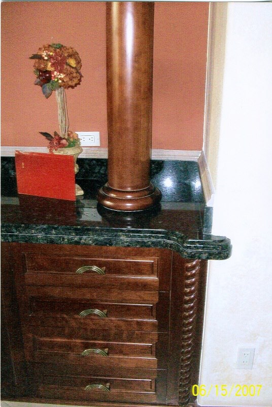 Turned column and cherry buffet with granite top