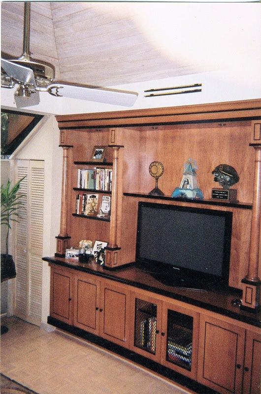 Built-in media wall with turned columns and display shelving