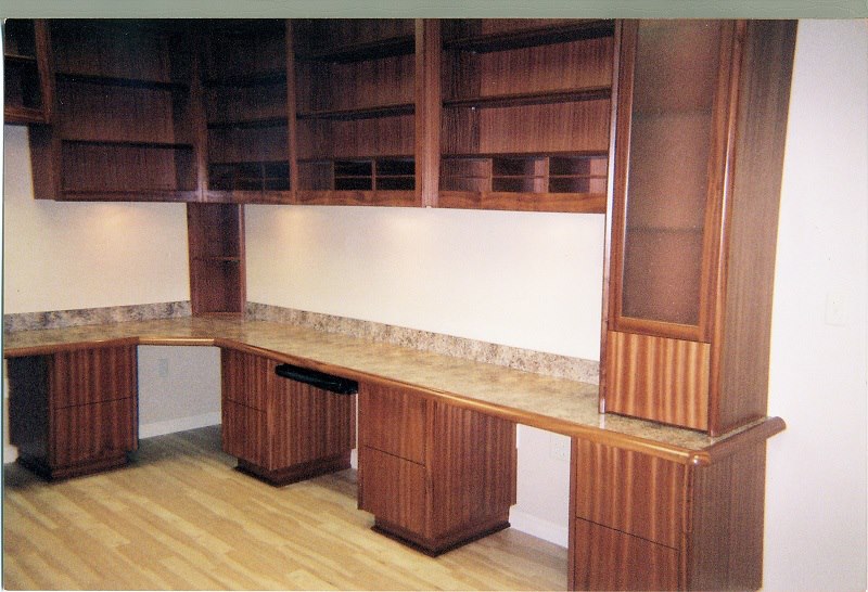 Corner desk built-in with stone top and fluted panels