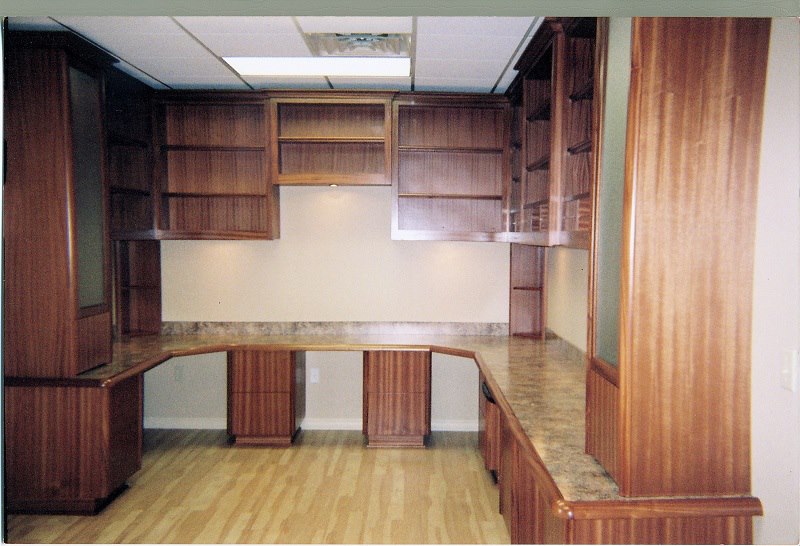 Mahogany home office with wraparound desk and uppers