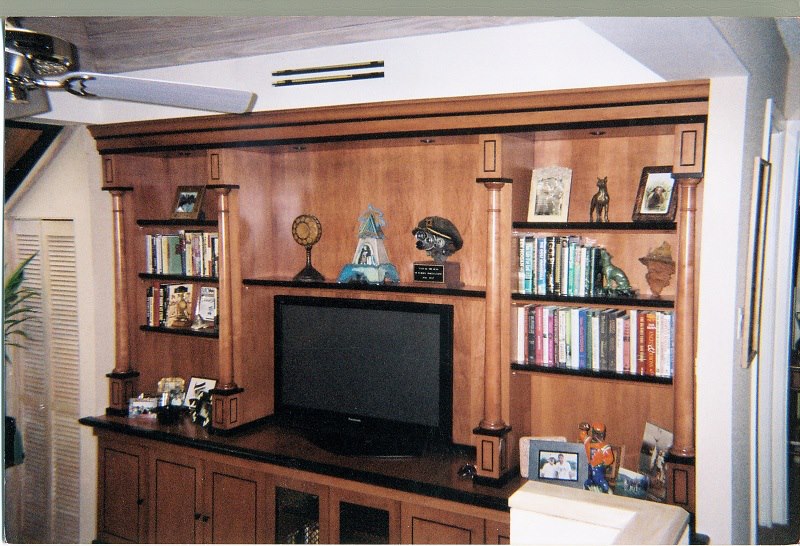 Media wall with adjustable shelves and a cabinet base