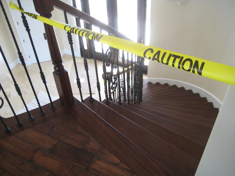 Winding staircase with dark hardwood treads