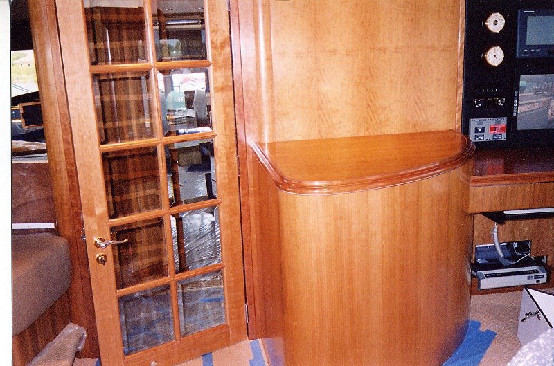High-gloss cherry cabinet with glass door