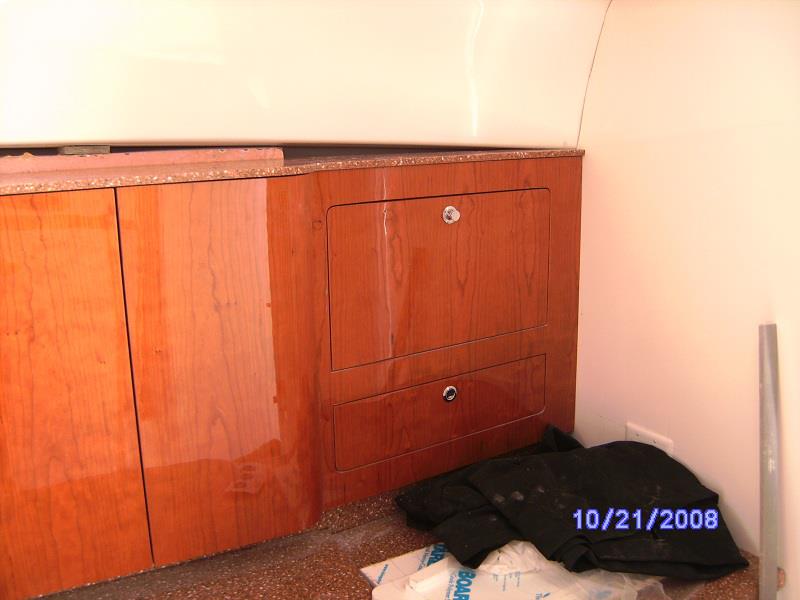 High-gloss cherry drawers and cabinetry in a sport boat