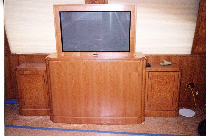 Motorized TV-lift cabinet in figured cherry