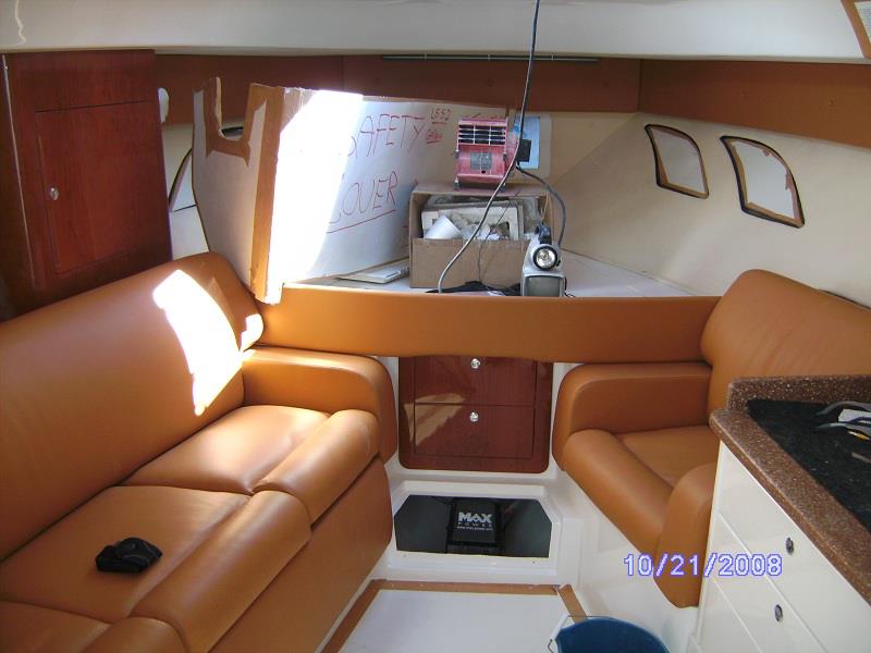 Sport-boat cabin with cherry joinery and leather seating