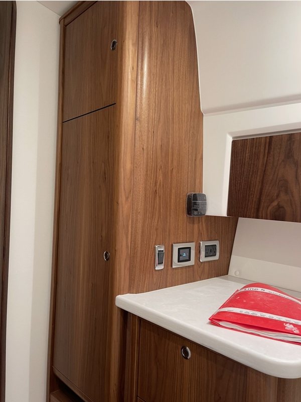 Tall walnut cabinet and drawers with a quartz counter