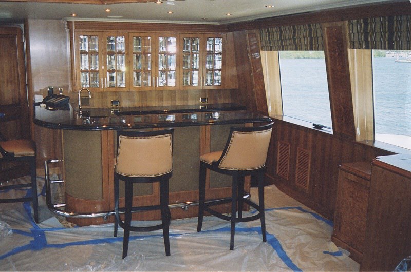 Yacht saloon bar with granite top and leather stools
